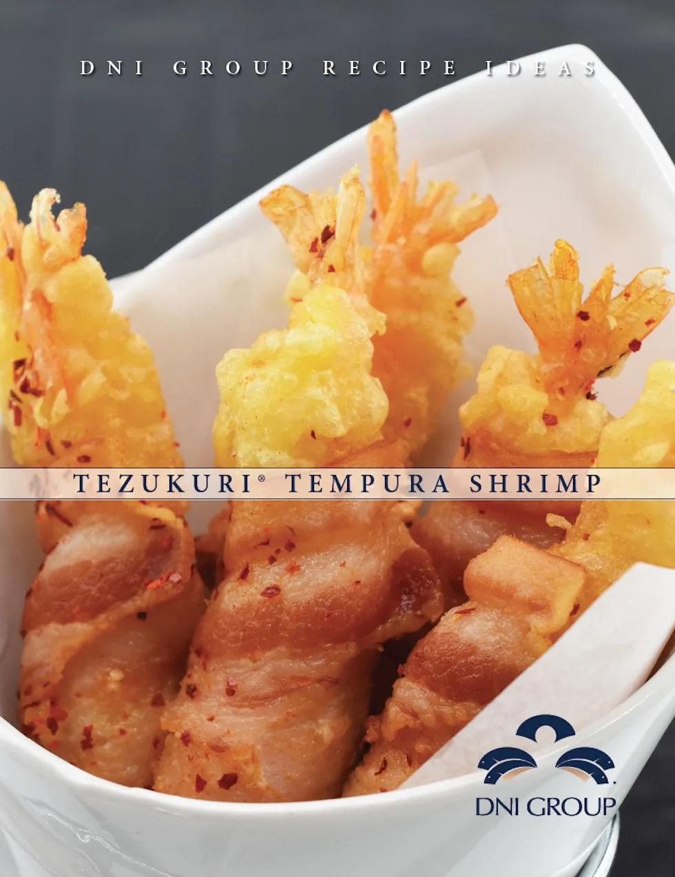 Golden-battered tempura shrimp with red spice garnish, ideal for wholesale foodservice and commercial food distribution.